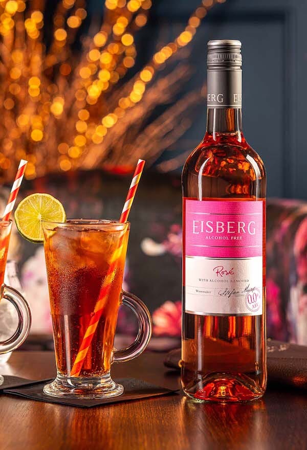 Cranberry Iced Tea Mocktail next to a bottle of Eisberg Alcohol Free Rose