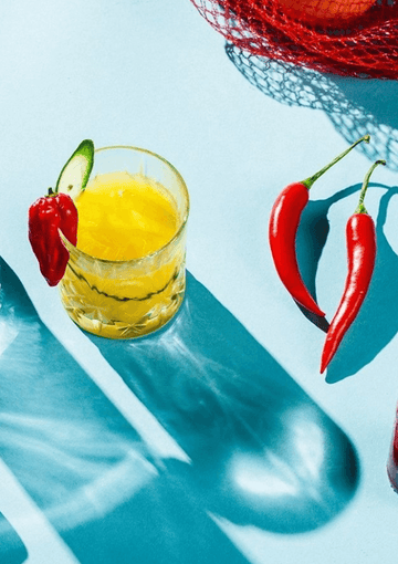 Gin mocktail garnished with fresh chilli