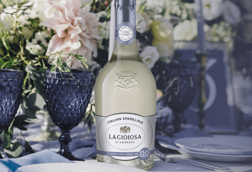 A bottle of La Gioiosa at a table set up with flowers