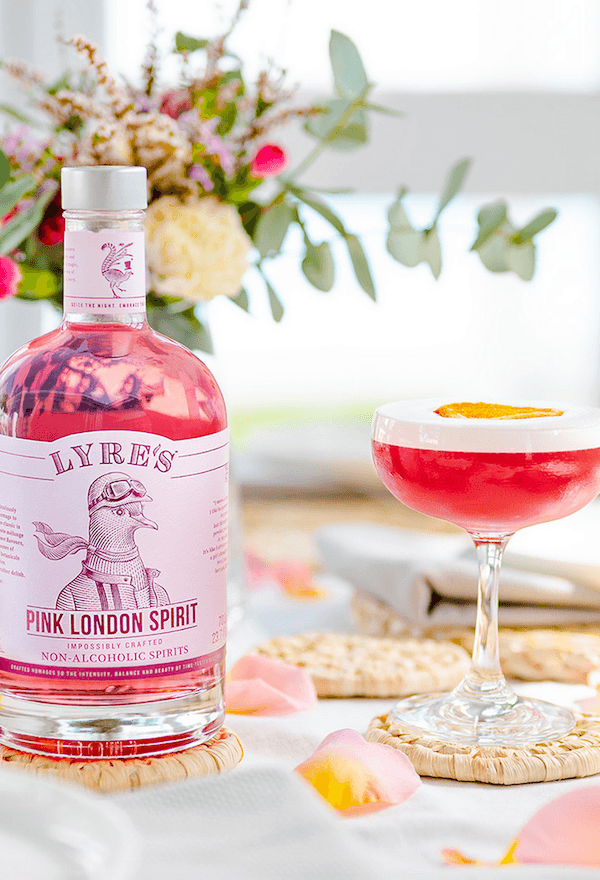Pink Lady Gin Mocktail made with Lyre's Pink London Spirit and garnished with lemon wheel Sans Drinks