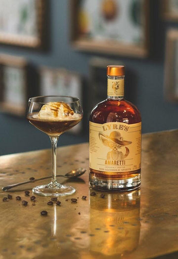 Affogato Mocktail with a scoop of vanilla ice-cream next to a bottle of Lyre's Amaretti 