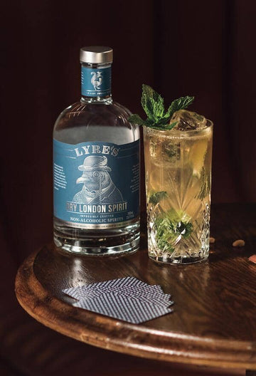 Bottle of Lyre's Dry London Spirit next to Gin Mule Mocktail 