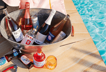 A drinks cooler ice bucket filled with Sans Drinks non-alcoholic drinks Sans Drinks