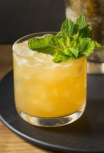 Ginger Mocktail garnished with mint leaves and made with Ms Sans Twist & Shout Citrus (Gin Substitute)