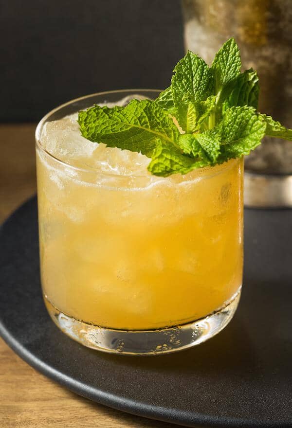 Ginger Mocktail garnished with mint leaves and made with Ms Sans Twist & Shout Citrus (Gin Substitute) Sans Drinks