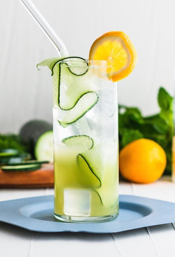 Cucumber Highball mocktail garnished with cucumber ribbons and orange wedges