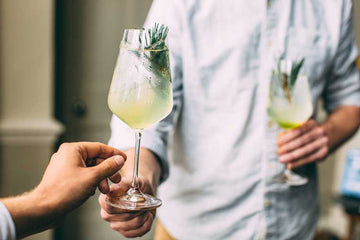 Two people enjoying non-alcoholic Gin Mocktails Sans Drinks