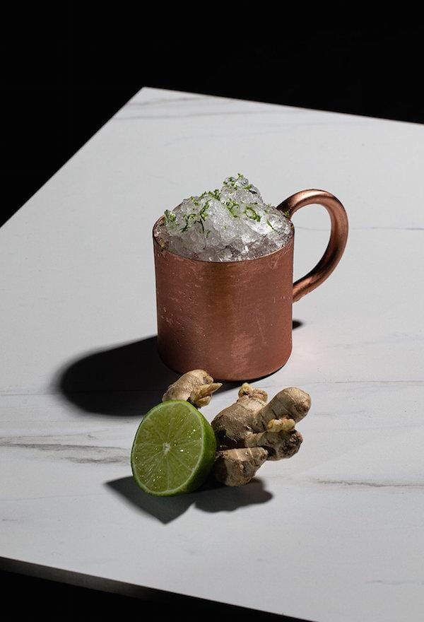 Gin mocktail in a copper mug made with ginger beer and ovant grace