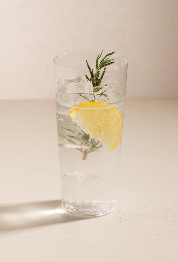 Non-alcoholic fizz made with Ovant Grace and garnished with lemon and rosemary 