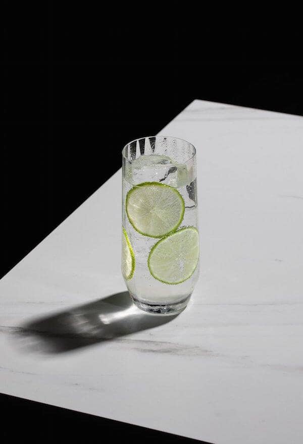 Gin mocktail made using Ovant Grace and garnished with lime wheels Sans Drinks
