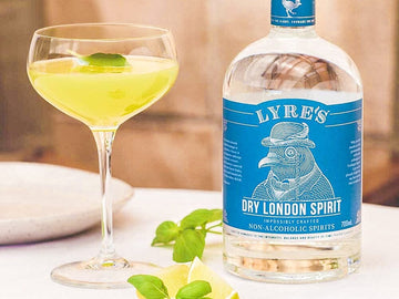 Basil Gimlet Gin Mocktail next to a bottle of Lyre's Dry London Spirit