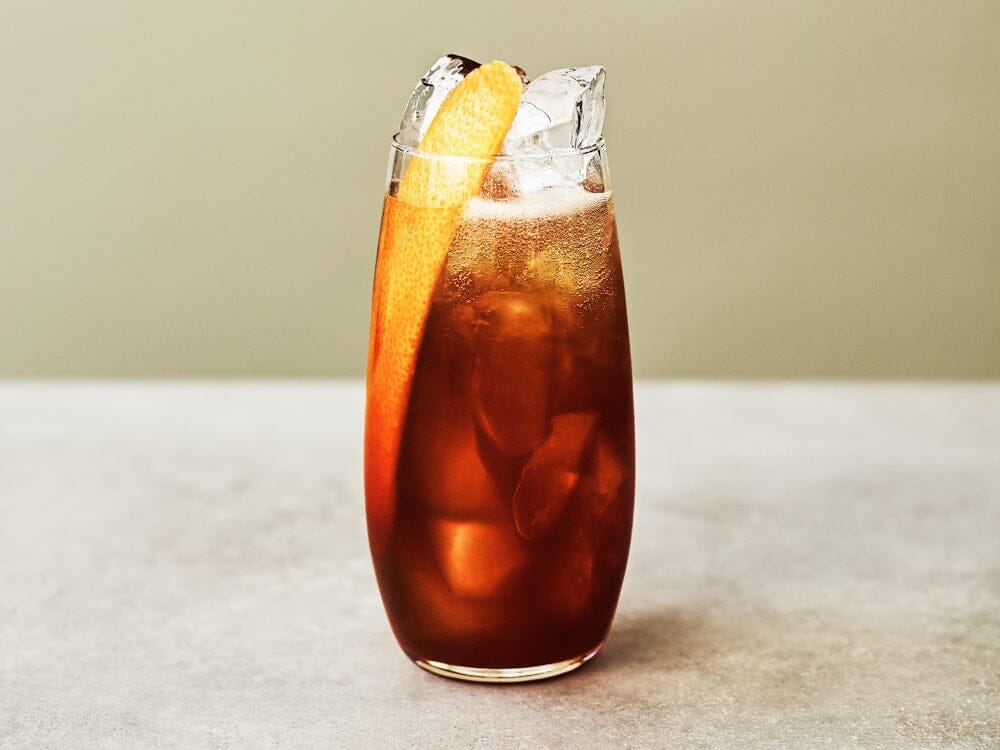 Cold brew mocktial made with Seedlip Spice 94 and garnished with pink grapefruit zest Sans Drinks