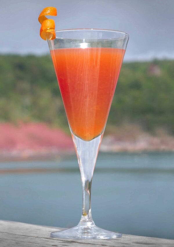 Cosmopolitan Mocktail with cranberry juice and garnished with orange zest