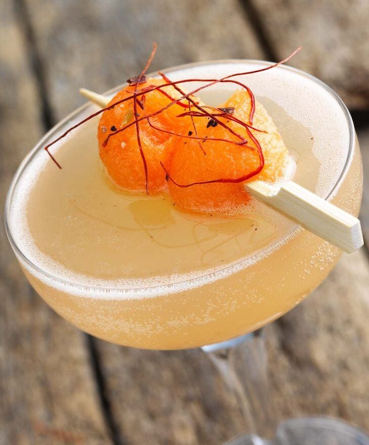 Spice Rack crush mocktail garnished with cantaloupe balls and made with Eisberg Alcohol-Free Sparkling White Wine