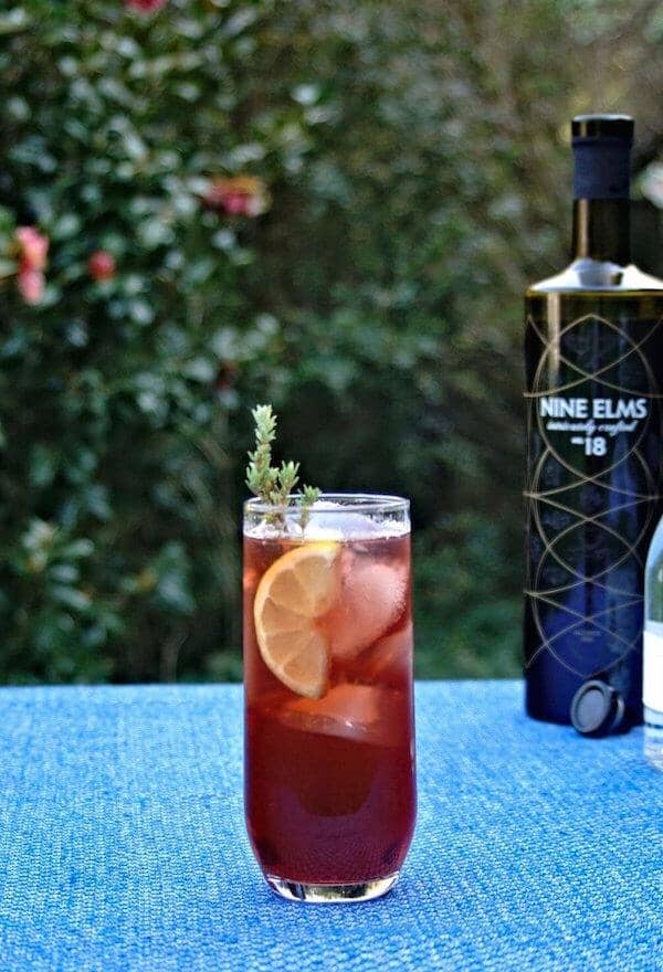Twenty three mocktail next to a bottle of nine elms 18 Sans Drinks
