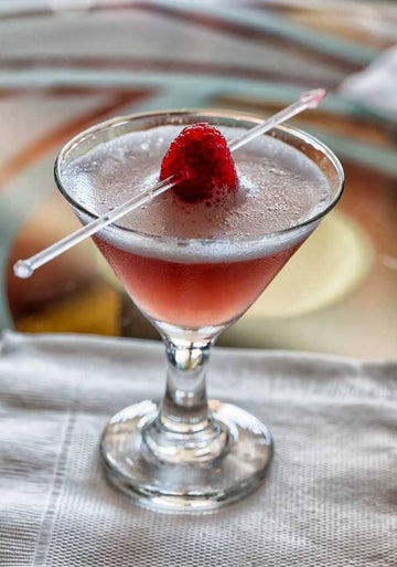 French martini mocktail made with Ms Sans Vodka Alternative Make Mine A Martini and garnished with raspberries