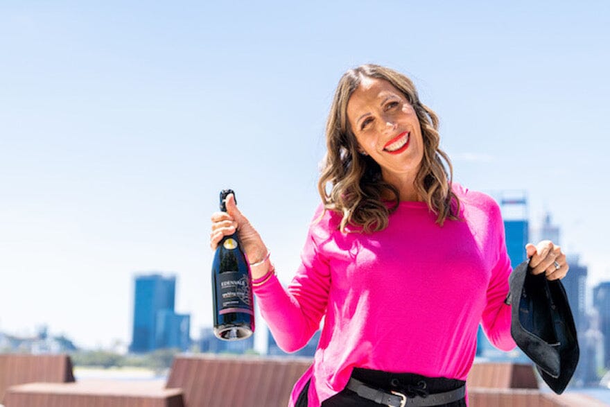 Sarah Rusbatch holding a bottle of Edenvale non-alcoholic wine Sans Drinks