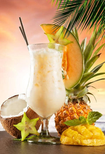 Alcohol-free Pina Colada garnished with mango and pineapple