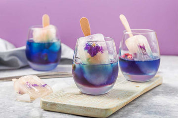 Three Butterfly Pea Gin Mocktails on a table