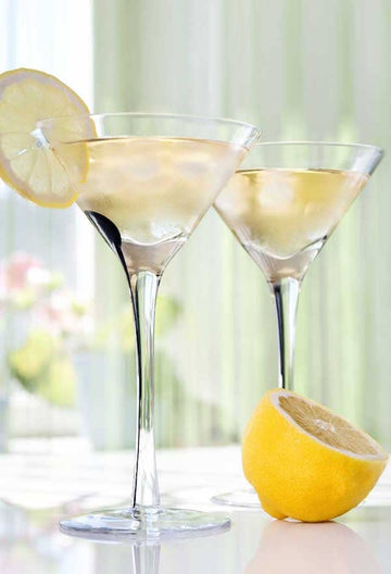 Two martini glasses filled with Lemon Drop Mock Martini and garnished with lemon wheels