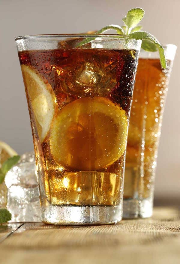 Non-alcoholic Long Island Iced Tea made with Sans Bar non-alcoholic spirits and garnished with fresh mint and lemon slices