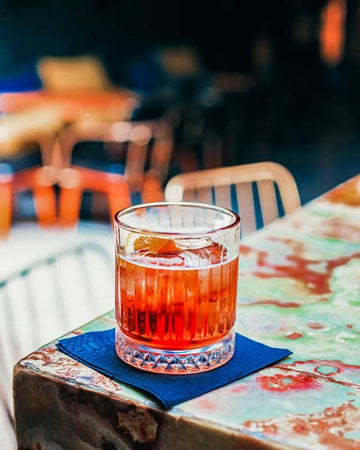 Claytons Negroni on a table made with Claytons Kola Tonic