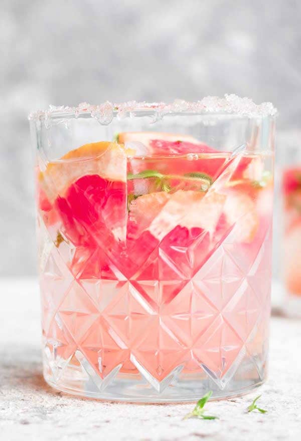 Pink Gin Spritz Mocktail made with Ms Sans Cherry Blossom Blush and garnished with grapefruit slices