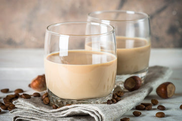 A glass filled with non-alcoholic baileys irish cream liqueur Sans Drinks