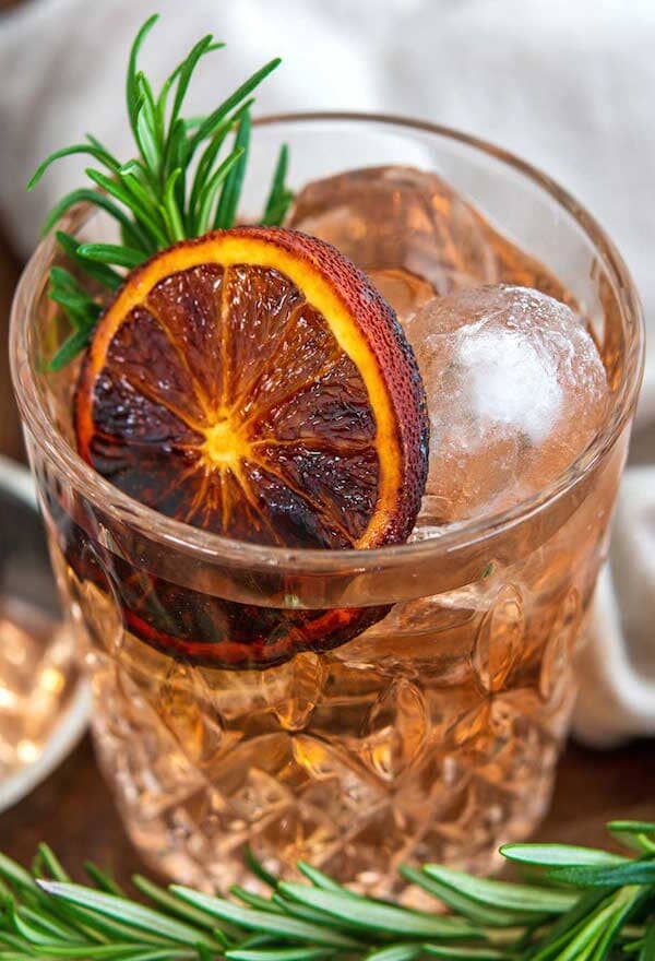 Spiced Gin and Tonic made with Ms Sans Twist & Shout Citrus and garnished with an orange wheel