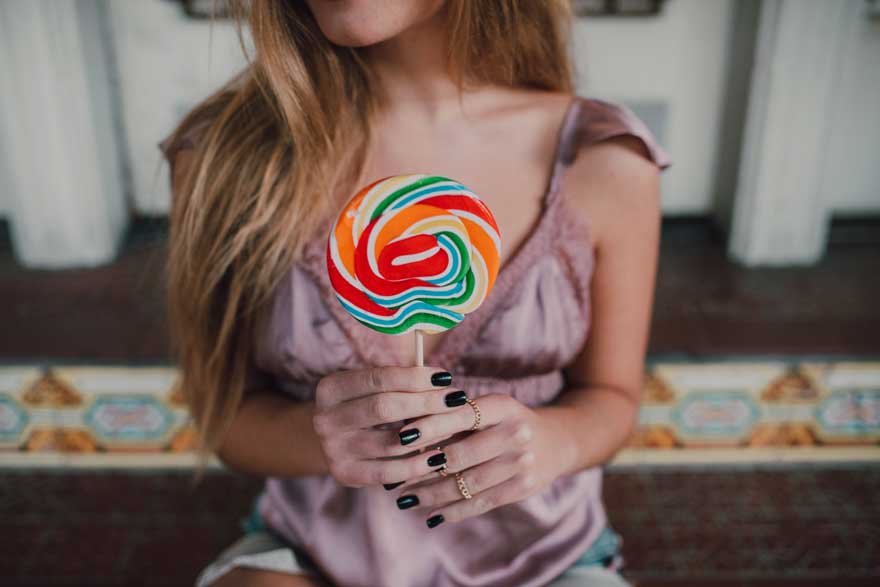 Woman holding a lollipop